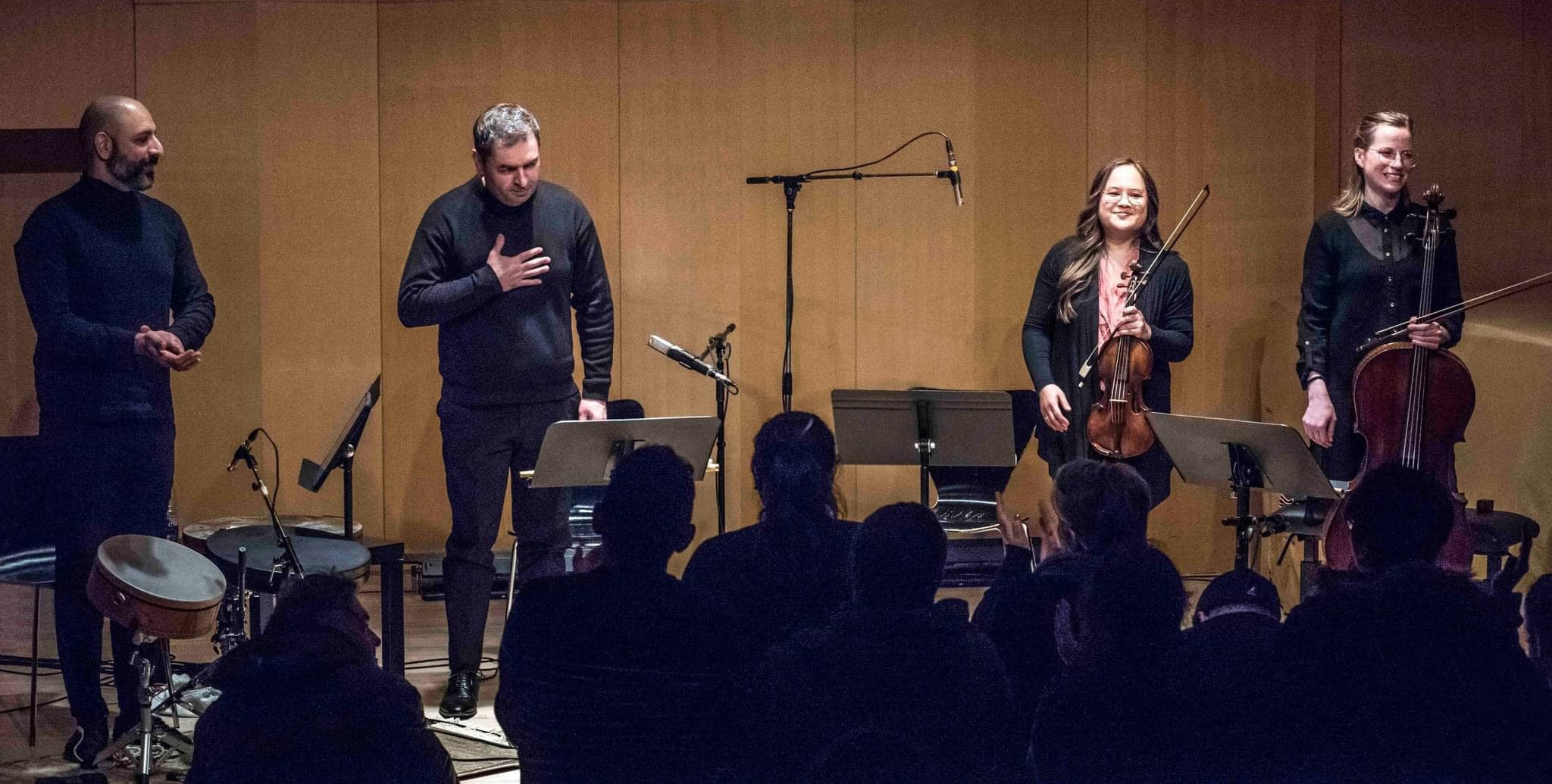 Musicians acknowledging their audience after a live performance